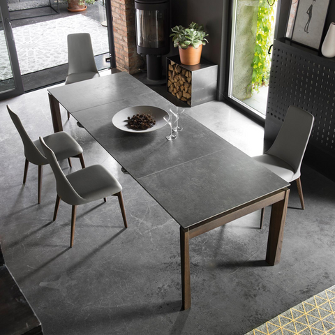 Esteso extendable dining table staged with lead grey top