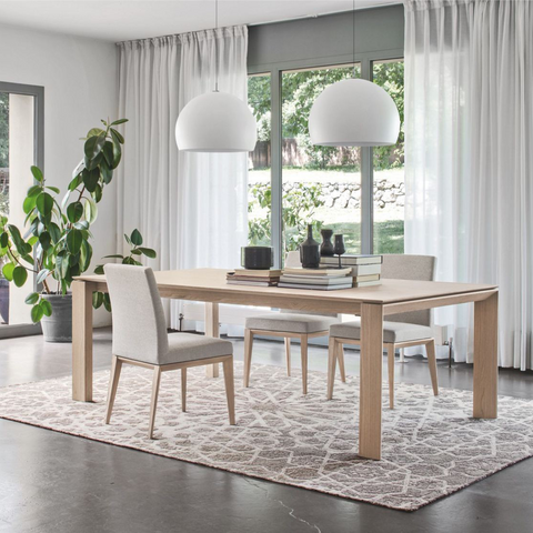 calligaris omnia 180 extendable wood dining table staged in natural