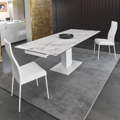 echo dining table in marble top with white frame and base staged in white