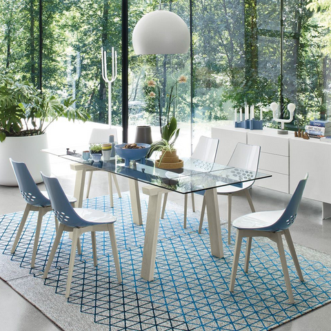 levante extendable dining table staged with blue